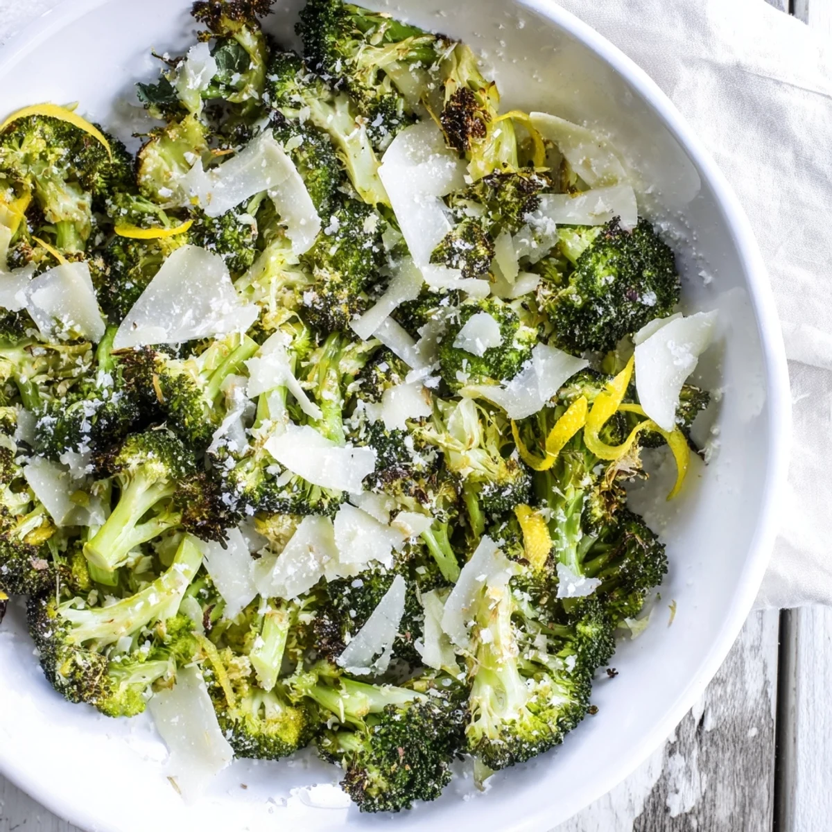 Hot Simple Garlic and Parmesan Roasted Broccoli, perfectly roasted florets with garlic and cheese.