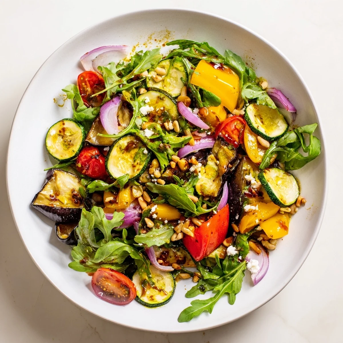 Enjoy a fresh, flavorful serving of Roasted Vegetable Salad, perfect as a vibrant vegetarian meal.