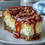 Warm slice of Caramel Cream Cheese Bread served on a plate, showcasing the rich caramel ribbon and moist, tender crumb.