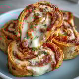 These spiral Tortilla Pizza Rolls offer a crispy crust and gooey cheese pull, perfect for game day.