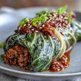 Gently steamed Korean Cabbage Rolls bursting with savory spiced beef, perfect as a light entree.