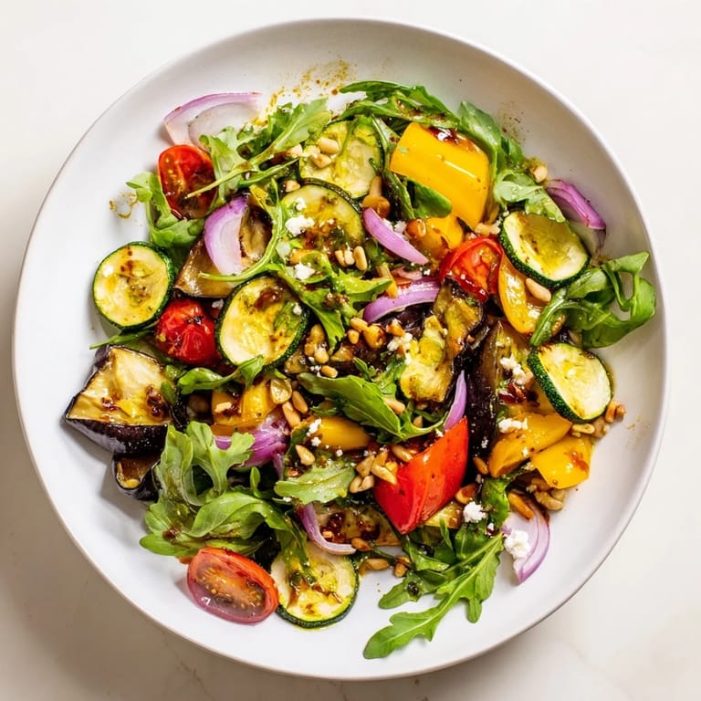 Enjoy a fresh, flavorful serving of Roasted Vegetable Salad, perfect as a vibrant vegetarian meal.