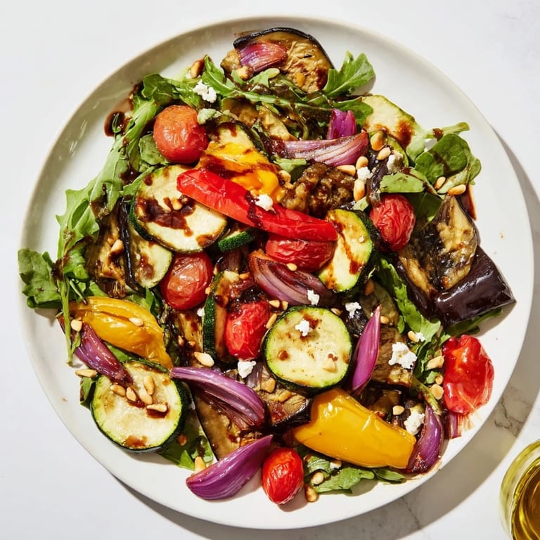 Visualize the appealing Roasted Vegetable Salad, a beautiful mix of roasted and fresh salad ingredients.