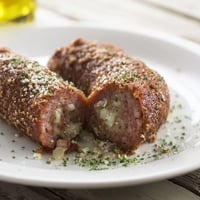 Golden-brown Homemade Savory Sausage Rolls fresh from the oven, offering a delightful aroma and texture.