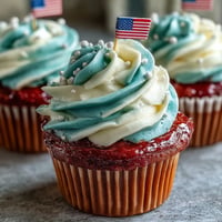 Star-Spangled Banner Cupcakes with a patriotic red, white, and blue swirled frosting.