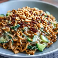 Cold peanut sesame noodles with crisp cucumber and a creamy, savory sauce.